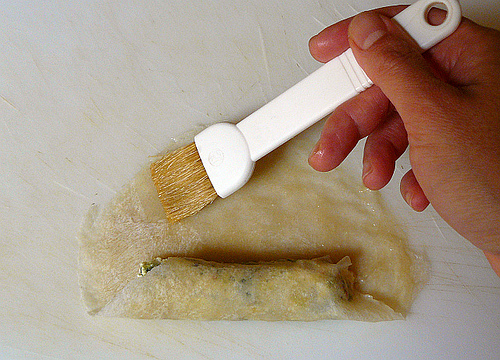 Sealing a Shanghai spring roll skin Sealing a Shanghai spring roll skin