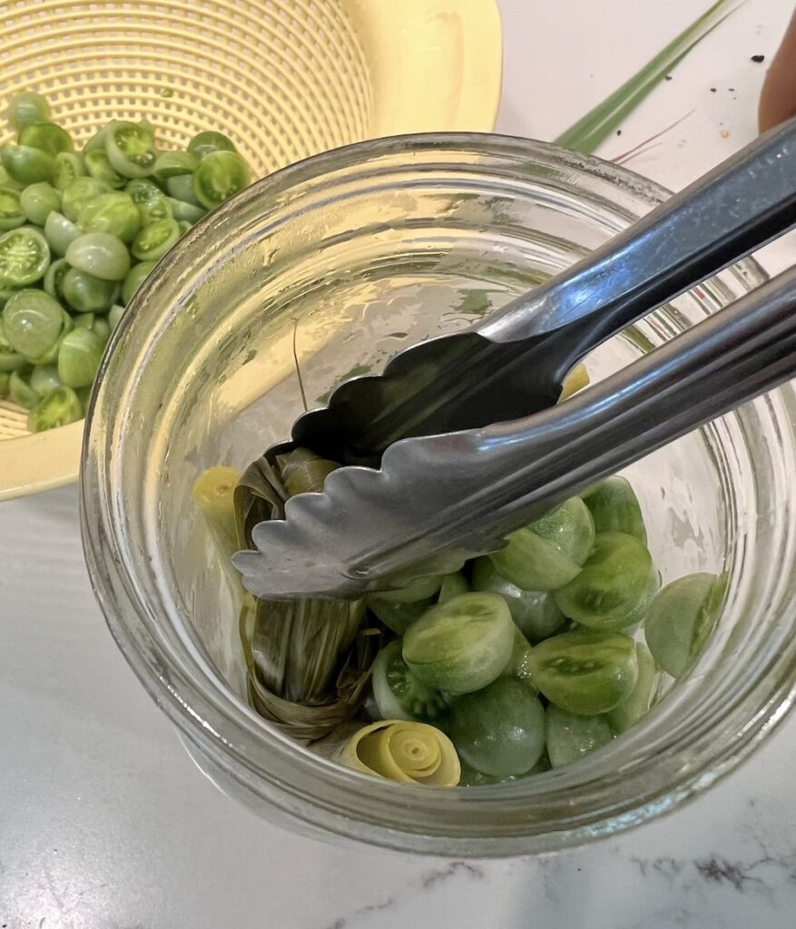 filling pickled tomatoes